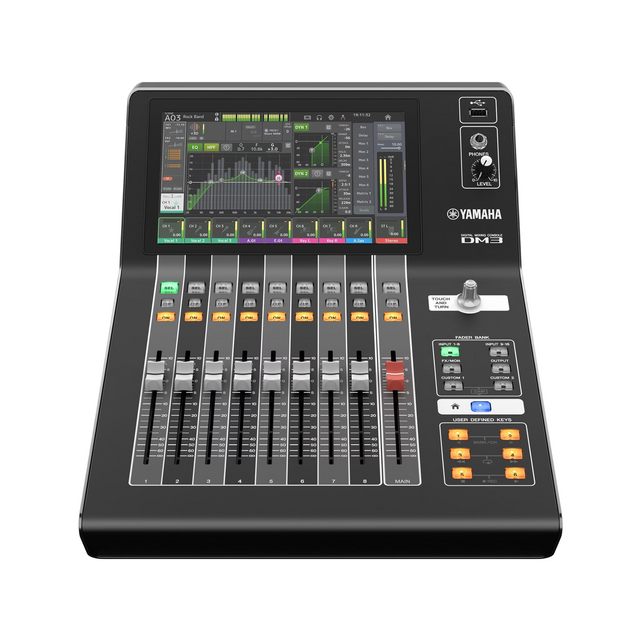 Yamaha DM3 digital mixing console with a display screen, multiple control knobs, and buttons on the front panel.